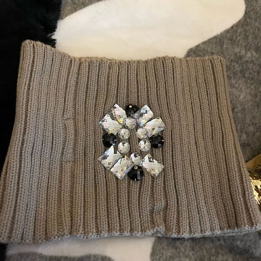 Betsey johnson 
Tan knit w/jewel rhinestone crystal snood/scarf neck warmer